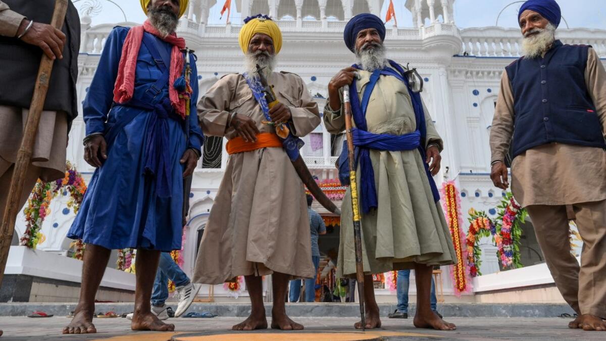 Sikh pilgrims gather as they take part in a ritual procession at a shrine in Nankana Sahib, some 75 kms west of Lahore on November 7, 2019, on the occasion of the 550th birth anniversary of Guru Nanak Dev. A corridor that will allow Sikhs to cross from India into Pakistan to visit one of the religion's holiest sites is set to open on November 9, with thousands expected to make a pilgrimage interrupted by decades of conflict. Arif ALI / AFP