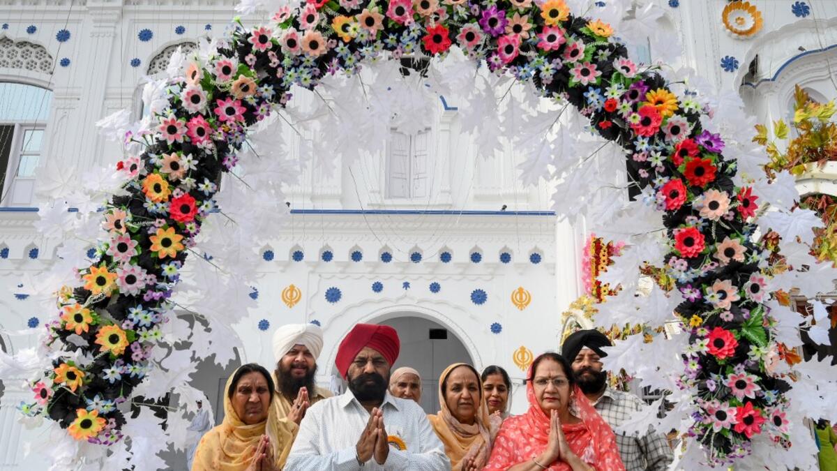 Sikh pilgrims pray as they take part in a ritual procession at a shrine in Nankana Sahib, some 75 kms west of Lahore on November 7, 2019, on the occasion of the 550th birth anniversary of Guru Nanak Dev. Arif ALI / AFP