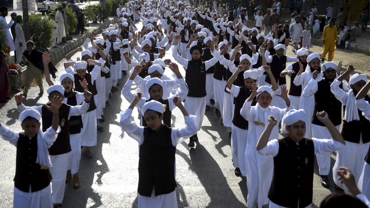 Muslim devotees take part in a procession to celebrate the birthday of Prophet Mohammed, in Karachi on November 10, 2019. The birthday of Prophet Mohammed, also known as 'Milad', is celebrated during the Islamic month of Rabi al-Awwal, which falls on 12 Rabi al-Awwal in Islamic calendar. Rizwan TABASSUM / AFP