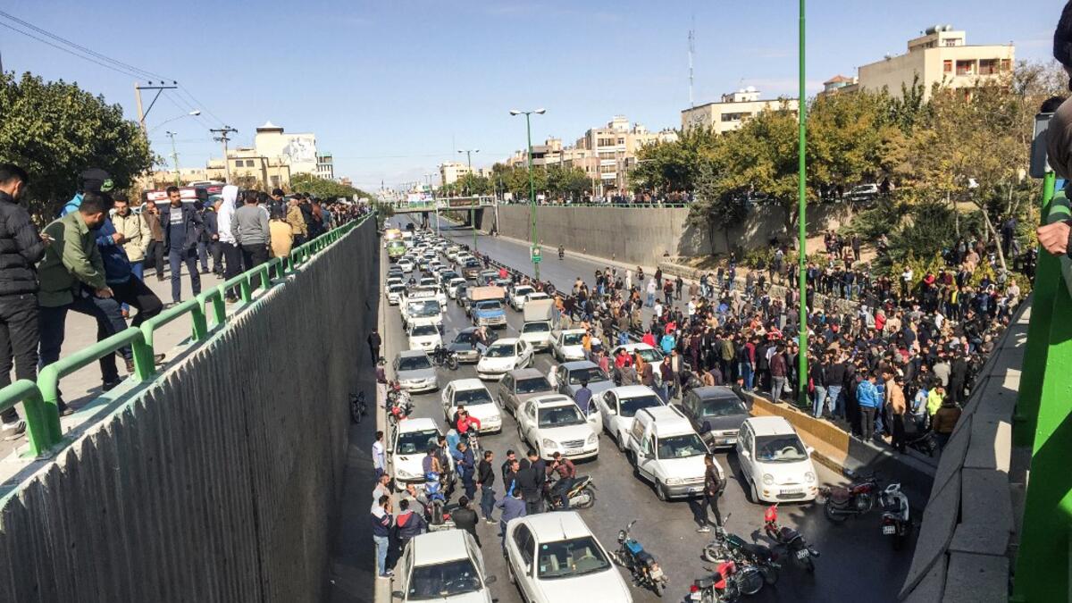 Iranian protesters block a road during a demonstration against an increase in gasoline prices in the central city of Isfahan, on November 16, 2019. AFP