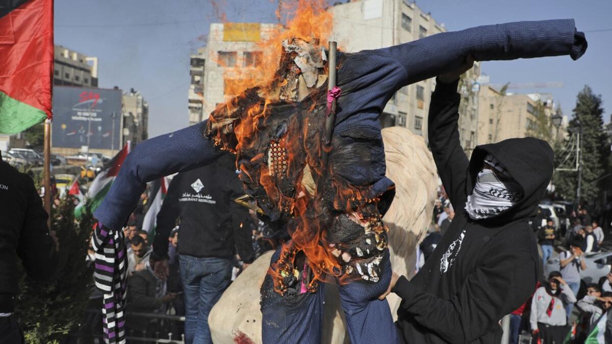 A Palestinian convicted over the killing of three Israelis died of cancer in custody today, officials said. The death, which sparked Palestinian accusations of neglect, comes amid heightened tension with protests already scheduled in multiple places in the occupied West Bank Tuesday. ABBAS MOMANI / AFP