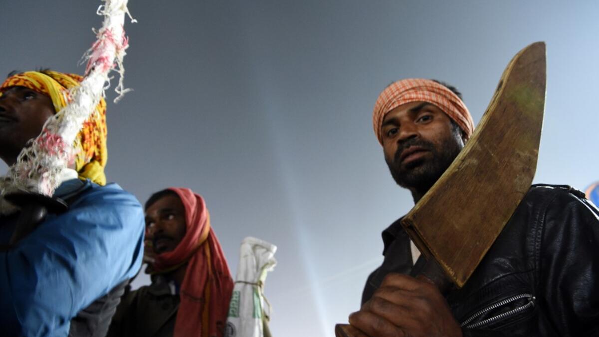 Hindu devotees carry their blades on the eve of the Gadhimai festival in Bariyarpur, south of the Kathmandu on December 2, 2019. Thousands of Hindu devotees gathered in southern Nepal on December 2 ahead of a festival believed to be the world's biggest ritual animal slaughter, despite court orders and calls by animal activists to end the event. The sacrifices, set to begin on December 3, take place every five years in Bariyarpur village close to the Indian border, in honour of the Hindu goddess of power. PR
