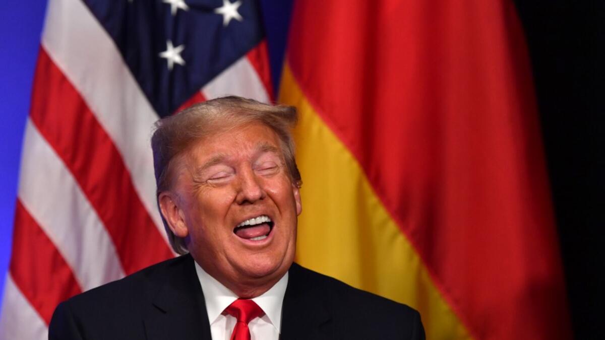 US President Donald Trump gestures during a bilateral meeting with German Chancellor Angela Merkel on the sidelines of the NATO summit at the Grove hotel in Watford, northeast of London on December 4, 2019. Nicholas Kamm / AFP