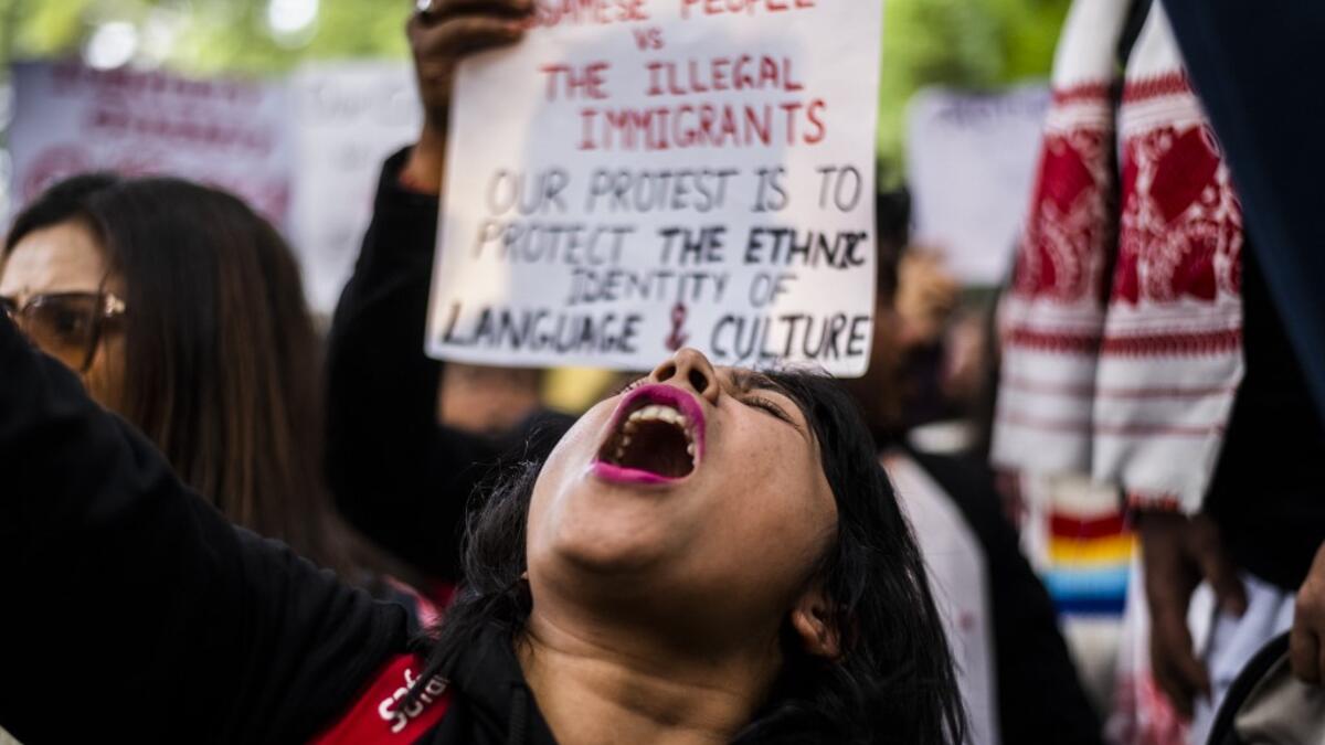 Protesters shout slogans during a demonstration against the Indian government's Citizenship Amendment Bill in New Delhi on December 14, 2019. Protests against a divisive new citizenship law raged on December 14 as Washington and London issued travel warnings for northeast India following days of violent clashes that have killed two people so far. Jewel SAMAD / AFP