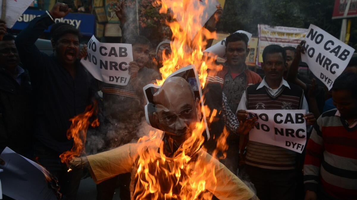 Protests against a divisive new citizenship law raged on December 14 as Washington and London issued travel warnings for northeast India following days of violent clashes that have killed two people so far. DIPTENDU DUTTA / AFP