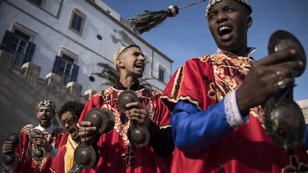 African rituals and Sufi traditions, was added to UNESCO's list of Intangible Cultural Heritage of Humanity earlier in the week. Gnawa refers to a "set of musical productions, fraternal practices and therapeutic rituals where the secular mixes with the sacred", according to the nomination submitted by Morocco. Often dressed in colourful outfits, Gnawa musicians play the guenbri, a type of lute with three strings, accompanied by steel castanets called krakebs. FADEL SENNA / AFP