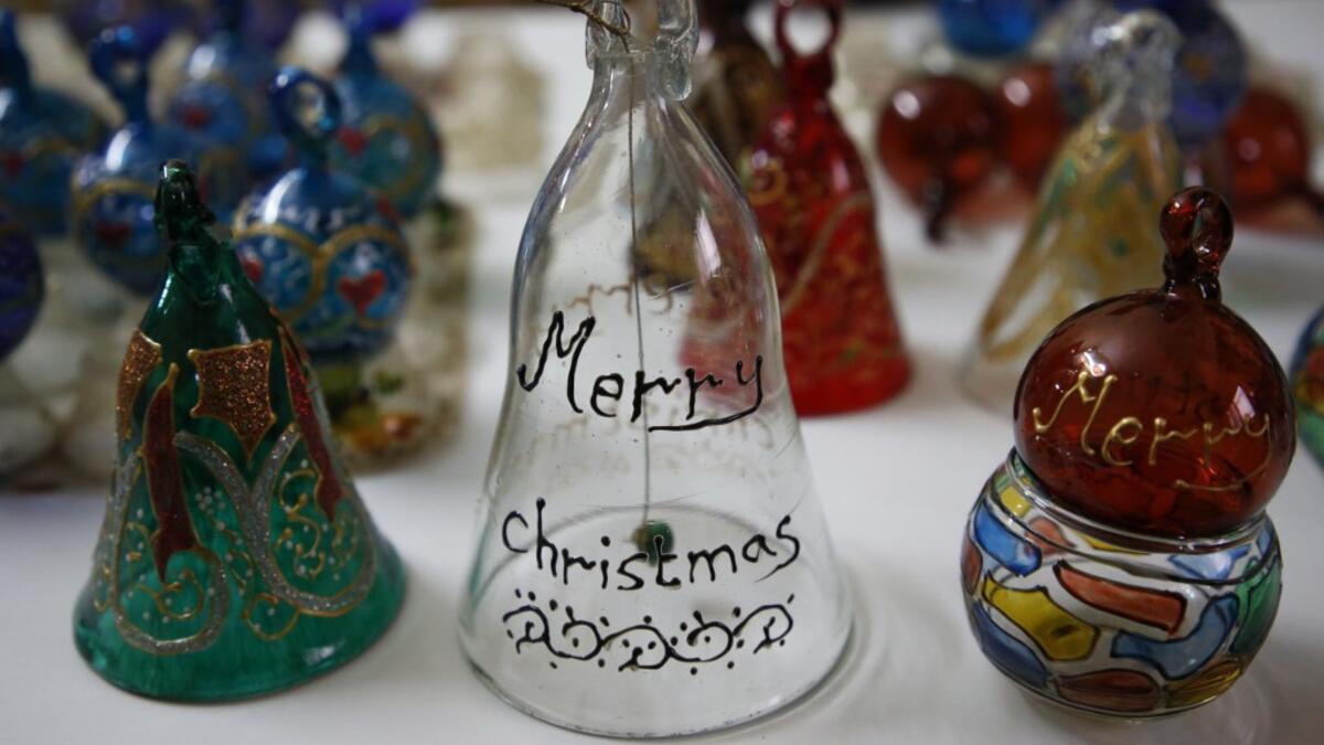 Christmas ornaments are displayed at a Palestinian glass workshop in the southern West Bank city of Hebron, on December 15, 2019. HAZEM BADER / AFP