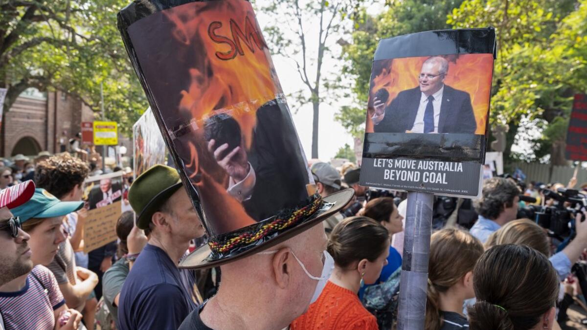 Demonstrators attend a climate protest in Sydney on December 19, 2019. Protesters marched on Australian Prime Minister Scott Morrison's official residence in Sydney to demand curbs on greenhouse gas emissions and highlight his absence on an overseas holiday as bushfires burned across the region. Wendell TEODORO / AFP