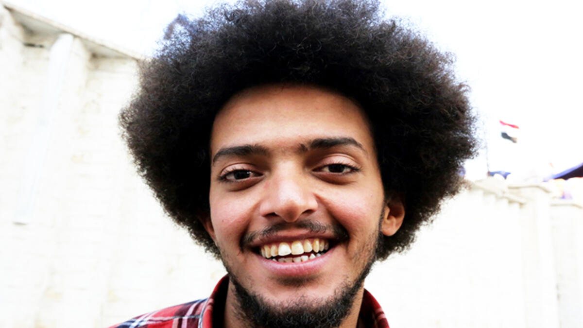 An Iraqi anti-government protestor poses with a distinct hairstyle at Tahrir Square in central Baghdad on December 23, 2019. Since the start of Iraq's anti-government protests on October 1, one thing strikes the eye perhaps above all else -- the unbridled hairstyles young men sport. High quiffs, tight fades and loads of attitude -- it is quite the male beauty pageant. SABAH ARAR / AFP