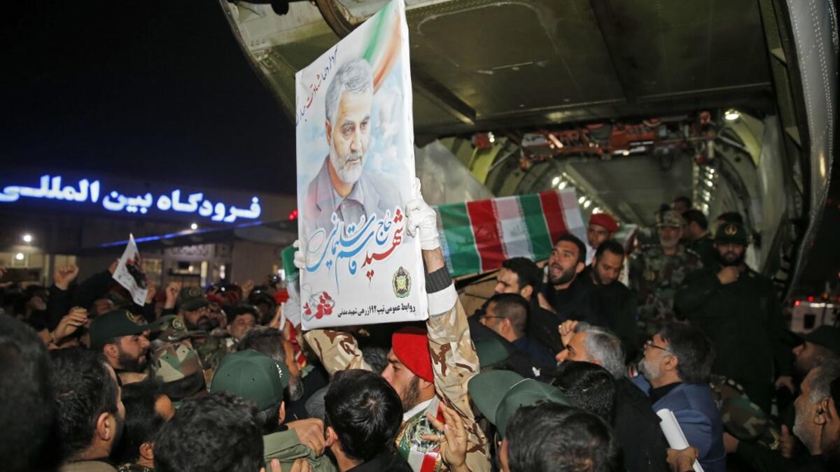 People carry the casket of Iranian commander Qasem Soleimani upon arrival at Ahvaz International Airport in Tehran on January 5, 2020. A tide of mourners packed the streets of the Iranian city of Ahvaz Sunday to pay respects to top general Qasem Soleimani, days after he was killed in a US strike. HOSSEIN MERSADI / fars news / AFP