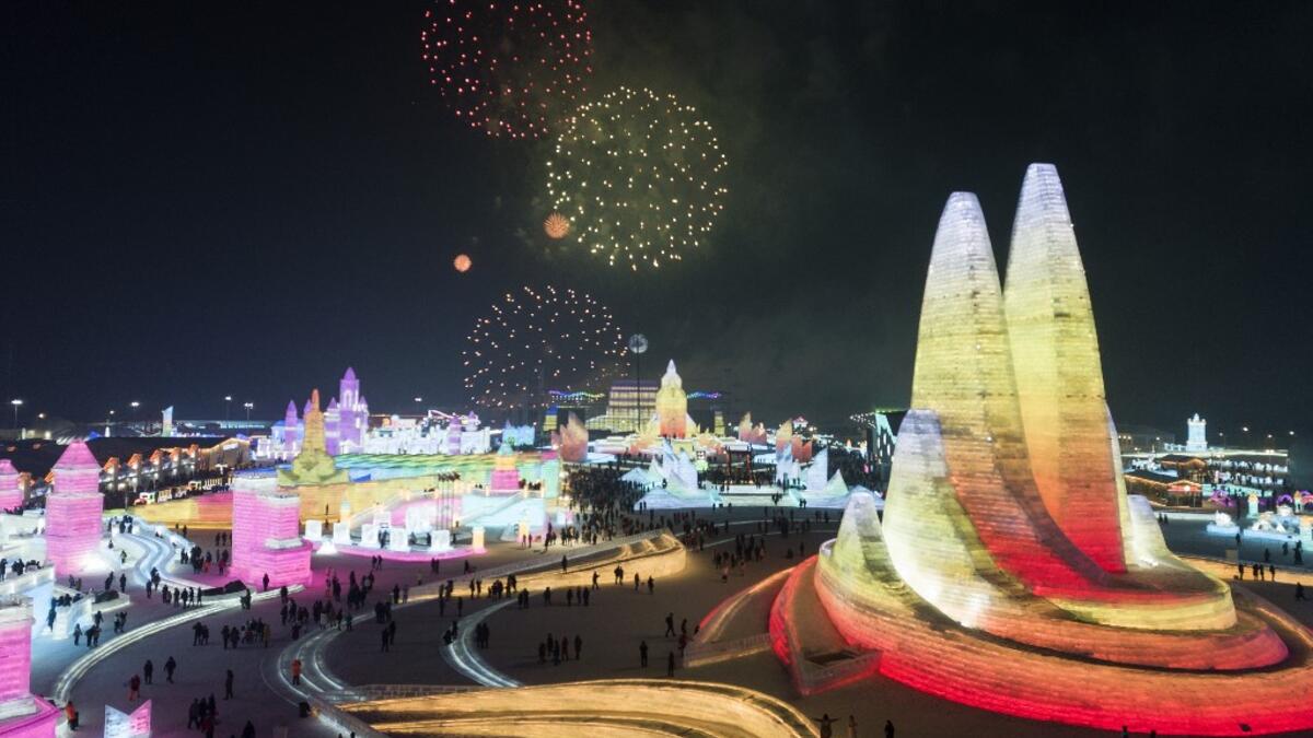 Tourists watch a fireworks display during the Harbin International Ice and Snow Festival in Harbin, in China's northeast Heilongjiang province on January 5, 2020. Noel CELIS / AFP