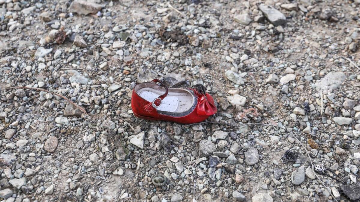 A child's shoe is pictured on January 8, 2020 at the scene of a Ukrainian airliner that crashed shortly after take-off near Imam Khomeini airport in the Iranian capital Tehran. Search-and-rescue teams were combing through the smoking wreckage of the Boeing 737 flight from Tehran to Kiev but officials said there was no hope of finding anyone alive. The vast majority of the passengers on the Ukraine International Airlines flight were non-Ukrainians, including 82 Iranians and 63 Canadians, officials said. Born