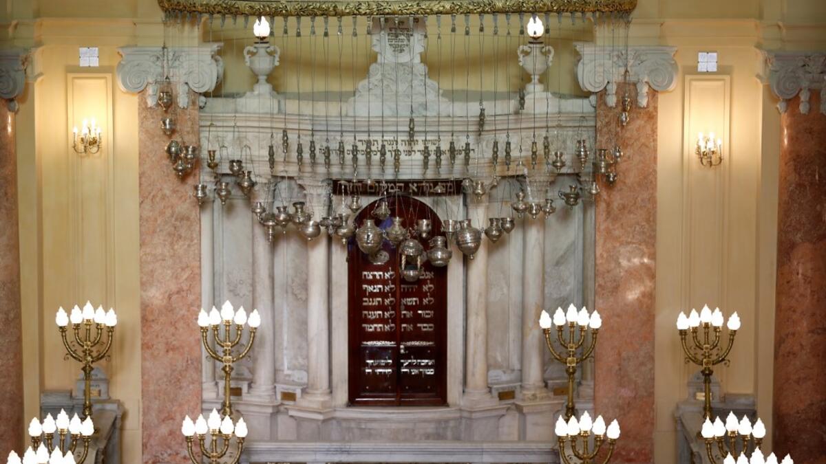 The synagogue, boasting green and violet stained glass windows and towering marble columns, was built in its current form in 1850 by an Italian architect on top of the original edifice dating back to 1354. Khaled DESOUKI / AFP
