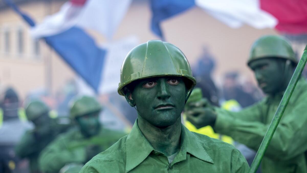 Masked revellers take part in a carnival procession through the south-western North Macedonian village of Vevcani, on January 13, 2020. The Vevcani carnival is 1.400 years old and is held every year on the eve of the feast of Saint Basil (January 14), which also marks the beginning of the New Year according to the Julian calendar, observed by the Macedonian Orthodox Church. Robert ATANASOVSKI / AFP