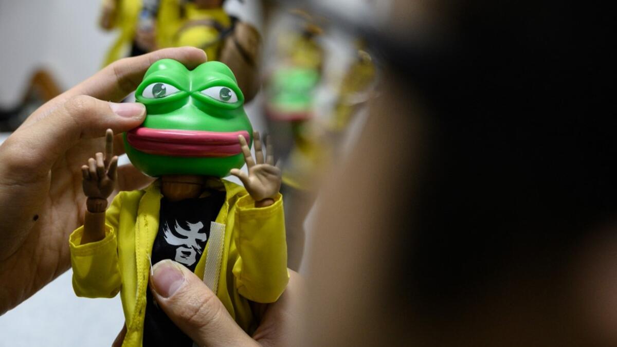 This picture taken on January 14, 2020 shows a 1:6 scale action figures depicting Pepe the Frog, a character used by pro-democracy activists as a symbol of their struggle in the Hong Kong protests, in Hong Kong. Intricately detailed Hong Kong protester figurines have become the latest must-have collectables as toy stores recreate the pro-democracy movement's street battles with police in their shop displays.  Philip FONG / AFP
