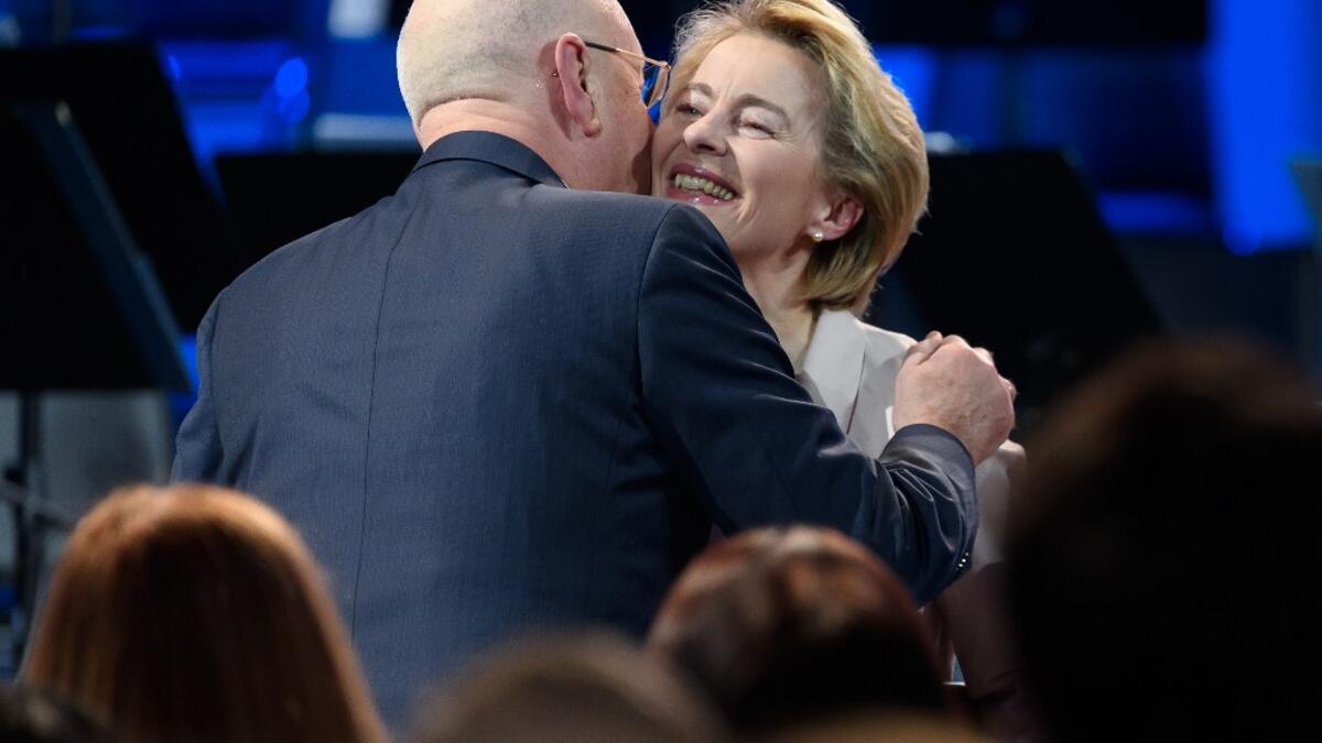 President of the European Commission Ursula von der Leyen (R) is greeted by World Economic Forum (WEF) founder and executive chairman Klaus Schwab after delivering a speech marking the 50th anniversary of the World Economic Forum during the WEF's annual meeting in Davos, on January 20, 2020. Fabrice COFFRINI / AFP
