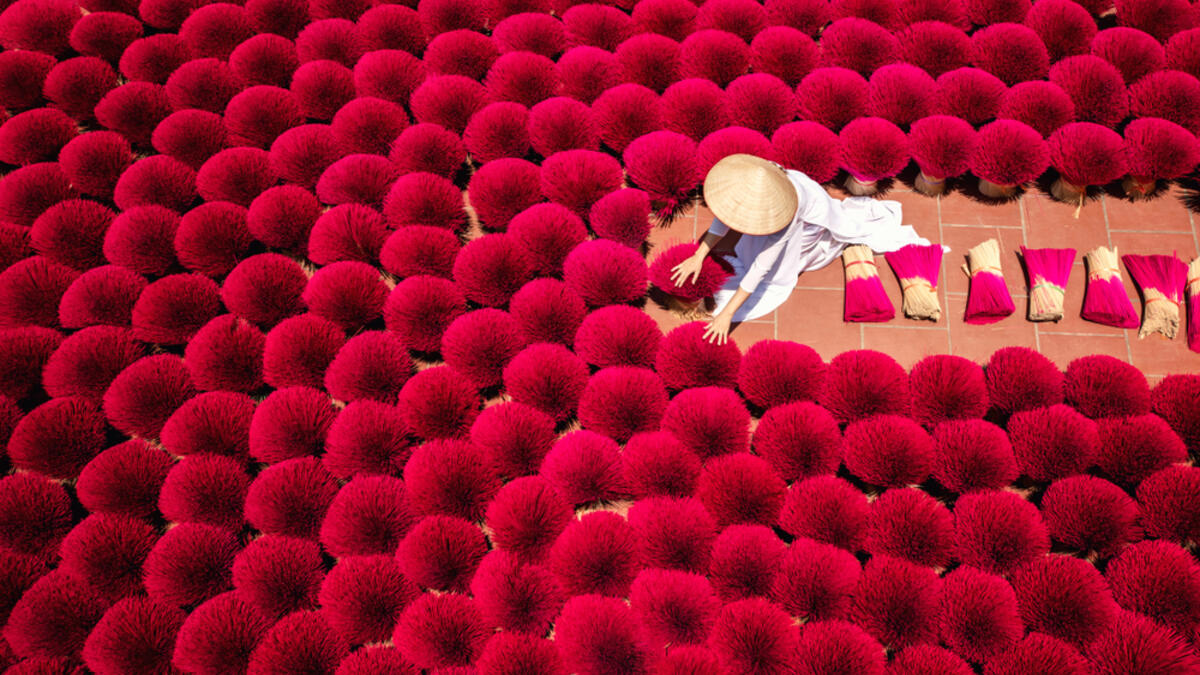 Vietnamese workers collect dried incense sticks in Quang Phu Cau village on the outskirts of Hanoi on January 9, 2020 ahead of the upcoming Lunar New Year celebrations, referred to in Vietnam as Tet. (Shutterstock)