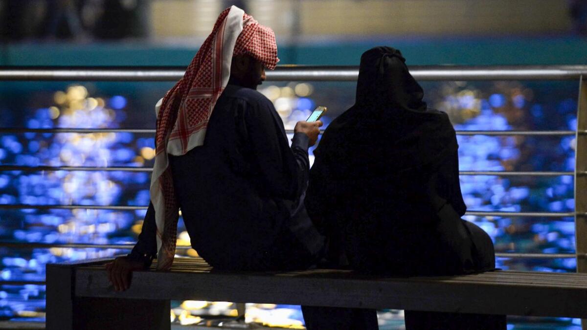 A picture taken on January 31, 2020 shows young Saudis gathering at the Riyadh Season Boulevard in the Saudi capital. In Saudi Arabia's rigid past, religious police once swooped down on rose sellers and anyone peddling red paraphernalia around Valentine's Day, but now a more open -- albeit risky -- dating culture is taking root. Pursuing relationships outside of marriage in the conservative Islamic kingdom once amounted to a death wish, and would-be Romeos resorted to pressing phone numbers up against their