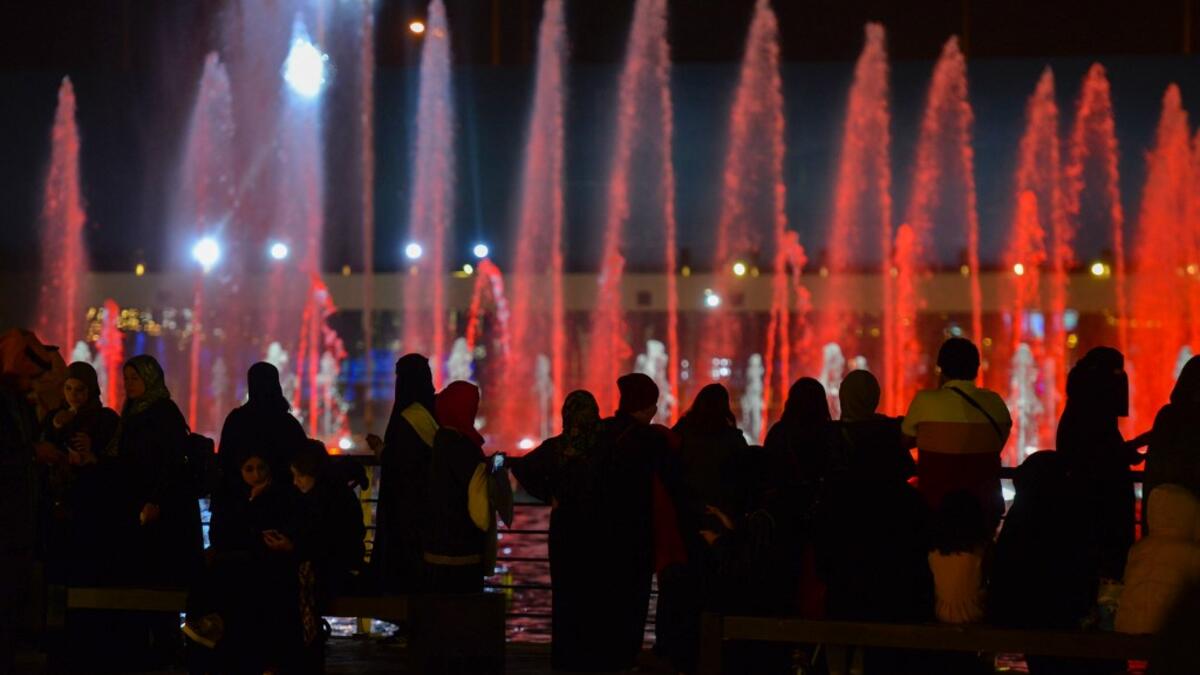 A picture taken on January 31, 2020 shows young Saudis gathering at the Riyadh Season Boulevard in the Saudi capital. In Saudi Arabia's rigid past, religious police once swooped down on rose sellers and anyone peddling red paraphernalia around Valentine's Day, but now a more open -- albeit risky -- dating culture is taking root. Pursuing relationships outside of marriage in the conservative Islamic kingdom once amounted to a death wish, and would-be Romeos resorted to pressing phone numbers up against their