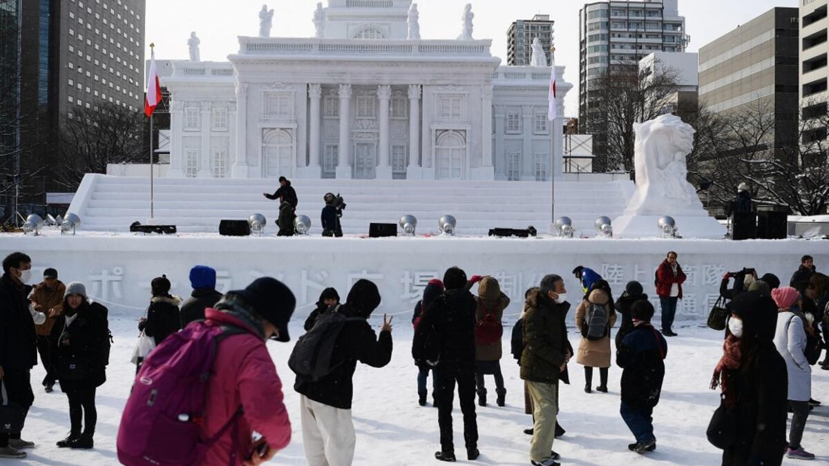 Organisers for this year's festival were forced to truck in an unprecedented amount of extra powder to build their signature sculptures after an unseasonably warm winter.  CHARLY TRIBALLEAU / AFP