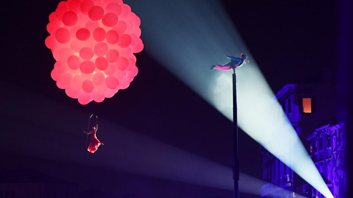 Artists performs during the opening day of the Venice Carnival on the Cannaregio Canal on February 8, 2020, in Venice. The carnival in Venice takes place until February 25, 2020. Vincenzo PINTO / AFP