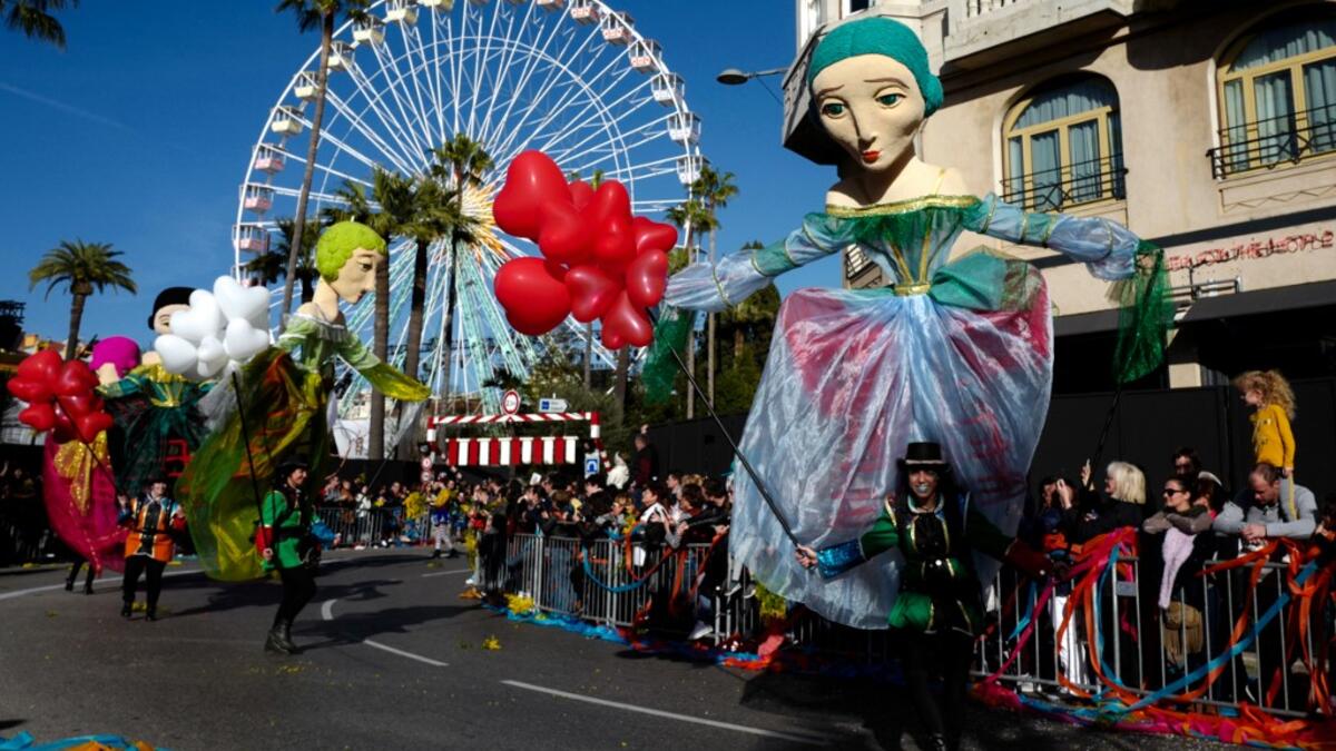 Participants take part in the 136th Nice Carnival parade which celebrates this year the 'Fashion King' in Nice, southeastern France, on February 15, 2020. The carnival runs from February 15 to February 29, 2020. VALERY HACHE / AFP
