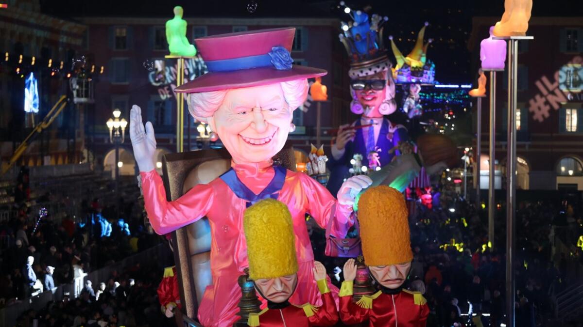 A giant figure depicting Queen Elizabeth II is seen during the 136th Nice Carnival parade in Nice, southeastern France, on February 15, 2020. The Carnival takes place until February 29, 2020 on the theme 'King of Fashion'. VALERY HACHE / AFP