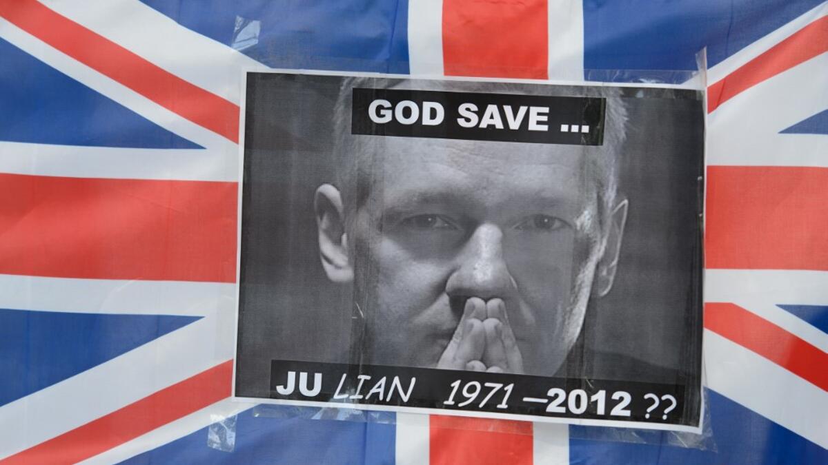 In this file photo taken on May 30, 2012 a portrait of Wikileaks founder Julian Assange is seen taped to a Union Flag outside the Supreme Court in central London, ahead of the verdict on Assange's bid to avoid extradition to Sweden. Later, Britain's Supreme Court ruled that Assange can be extradited to Sweden over alleged sex crimes, as it rejected his appeal. Jailed WikiLeaks founder Julian Assange is facing extradition to the United States over the 2010 publication of thousands of leaked classified docume