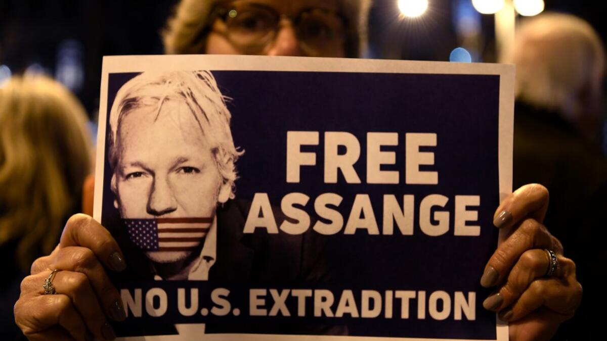 A demonstrator holds a sign during a protest called by Catalan National Assembly (ANC) under the motto "Journalism is not a crime" to support WikiLeaks founder Julian Assange in Barcelona on February 24, 2020. A British court today starts hearing Washington's extradition request for WikiLeaks founder Julian Assange in a test case of media freedoms in the digital age and the global limits of US justice. LLUIS GENE / AFP