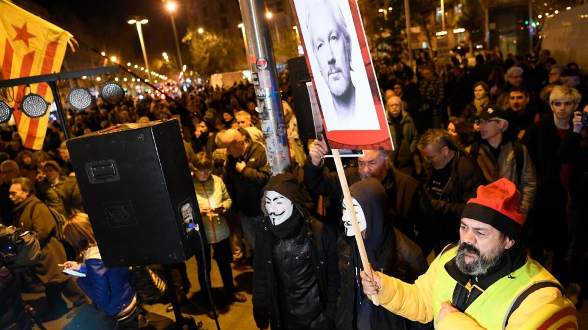 Demonstrators take part in a protest called by Catalan National Assembly (ANC) under the motto "Journalism is not a crime" to support WikiLeaks founder Julian Assange in Barcelona on February 24, 2020. A British court today starts hearing Washington's extradition request for WikiLeaks founder Julian Assange in a test case of media freedoms in the digital age and the global limits of US justice. LLUIS GENE / AFP