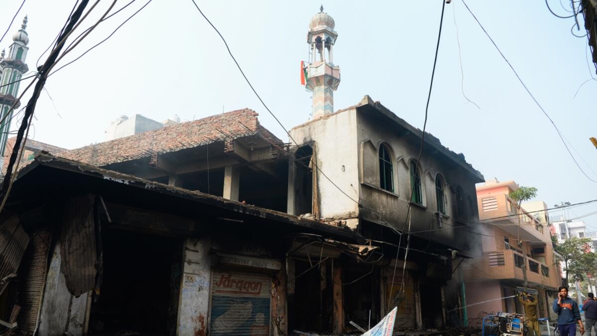 The mosque was set on fire in the Indian capital on Tuesday by Hindu mobs [Sajjad Hussain/AFP]