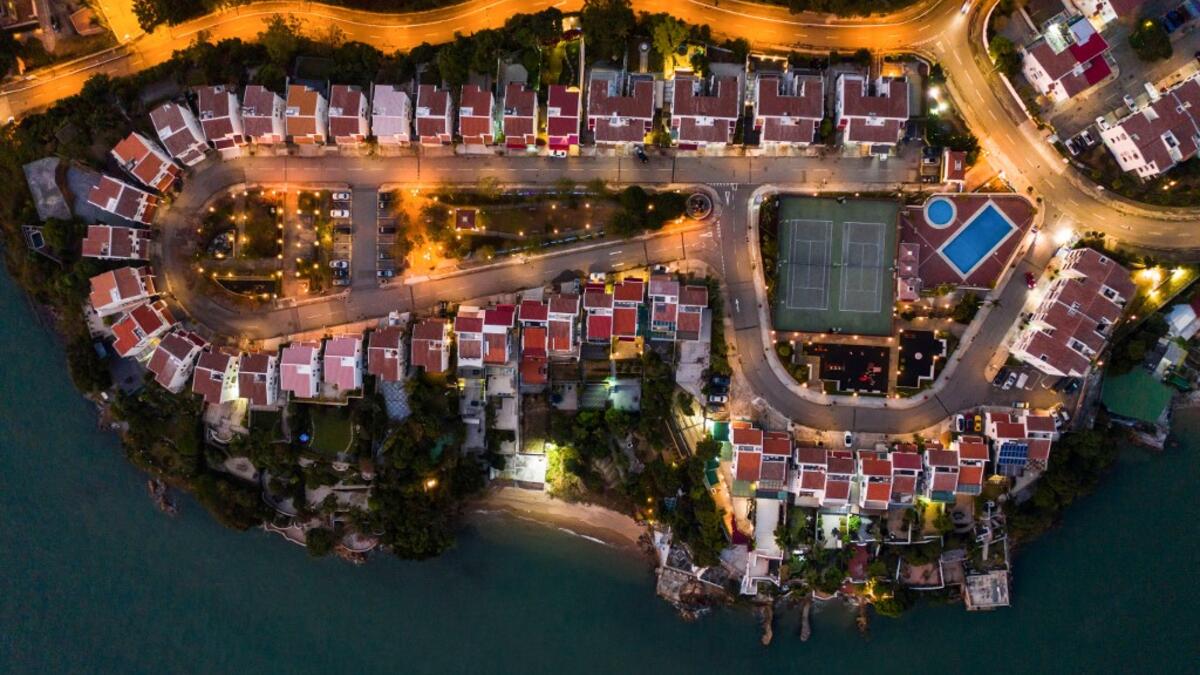 This aerial photograph taken on December 10, 2019 shows a housing estate in Hong Kong. DALE DE LA REY / AFP