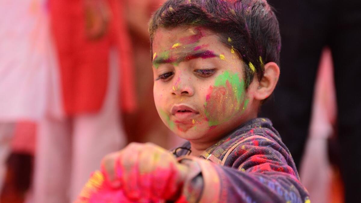 A child suffering from cerebral palsy celebrates Holi, the spring festival of colours, during an event origanized by Trishla Foundation, a non-profit organisation for cerebral palsy treatment, in Allahabad on March 6, 2020. SANJAY KANOJIA / AFP