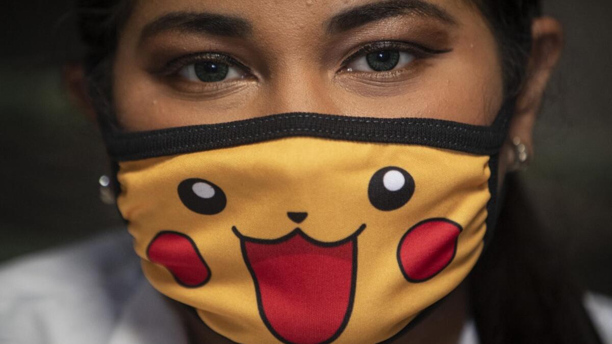 A doctor wears a face mask as a precautionary measure against the spread of the new coronavirus, COVID-19, as she waits for patients at a market in Managua, on March 18, 2020. The Nicaraguan government, which has not officially reported Covid-19 cases, continues to accept the arrival of tourists and massive activities, an attitude considered "irresponsible" by the opposition and health professionals. Inti OCON / AFP