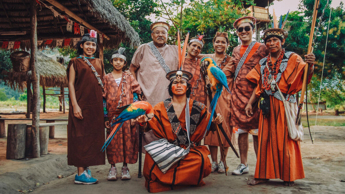 Ashaninkas and tourist group, natives of the jungle of Peru (Shutterstock)