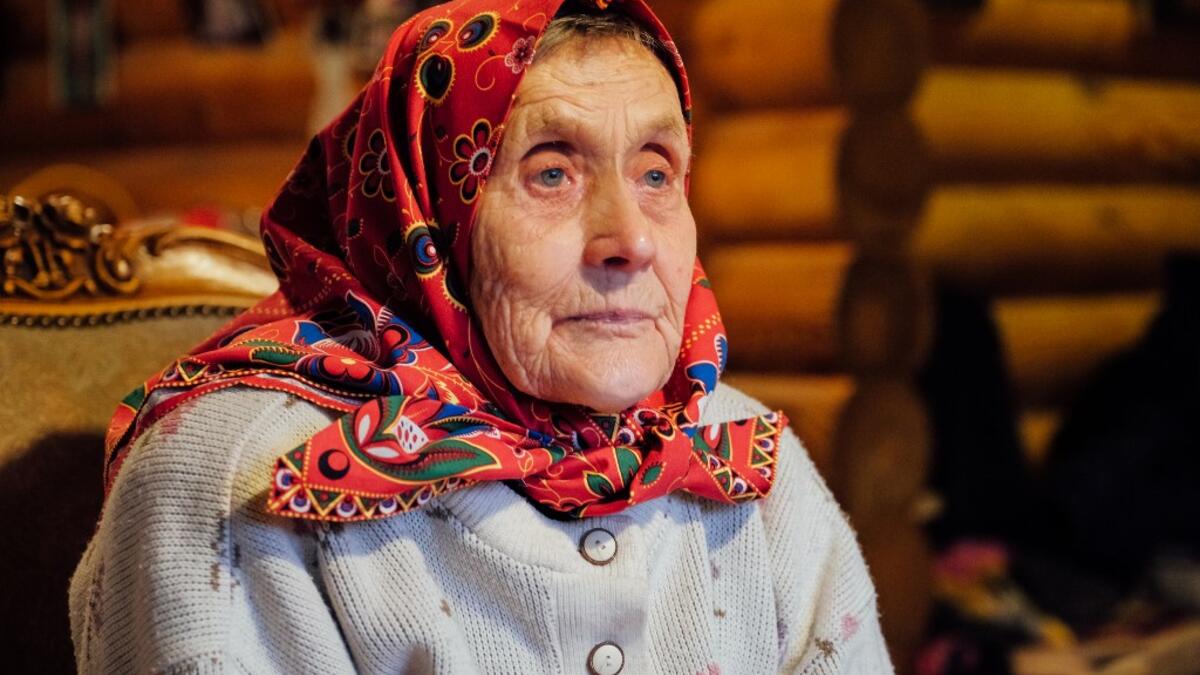 Nationally renowned folk singer Virve Köster answers journalists' questions on November 20, 2019 on Kihnu island in the Baltic Sea, 10 kilometres (six miles) off the coast of Estonia. Steeped in folk traditions, Kihnu's historic way of life however is now threatened as economic hardship drives more and more islanders away in search of work. Alessandro RAMPAZZO / AFP