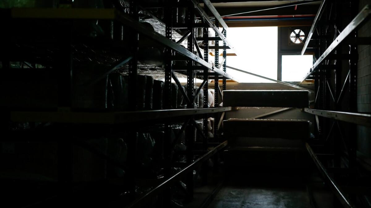 Coffins are stacked at the Eurocoffin coffins factory in Barcelona on April 3, 2020. More than 900 people died in Spain over the past 24 hours for the second day running, government figures showed, although the rate of new infections and deaths continued to slow. Spain has the world's second-highest death toll after Italy with the virus so far claiming 10,935 lives from 117,710 confirmed cases.  PAU BARRENA / AFP