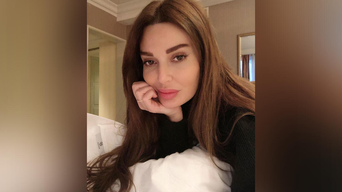 Cyrine Abdelnour taking selfies at home