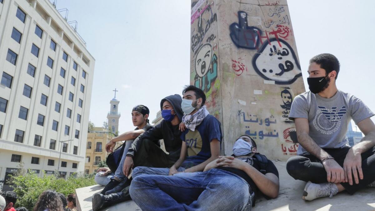 A handout picture released by the official Syrian Arab News Agency (SANA) on May 1, 2020, shows smoke billowing above buildings in Syria's central city of Homs. SANA said that the explosions ringing out of a Syrian army position in Homs resulted from a "human error during the transport of some ammunition, which led to human and material losses", while the Syrian Observatory for Human Rights, a Britain-based war monitor relying on sources inside Syria, said Israeli air strikes hit a missile depot belonging t