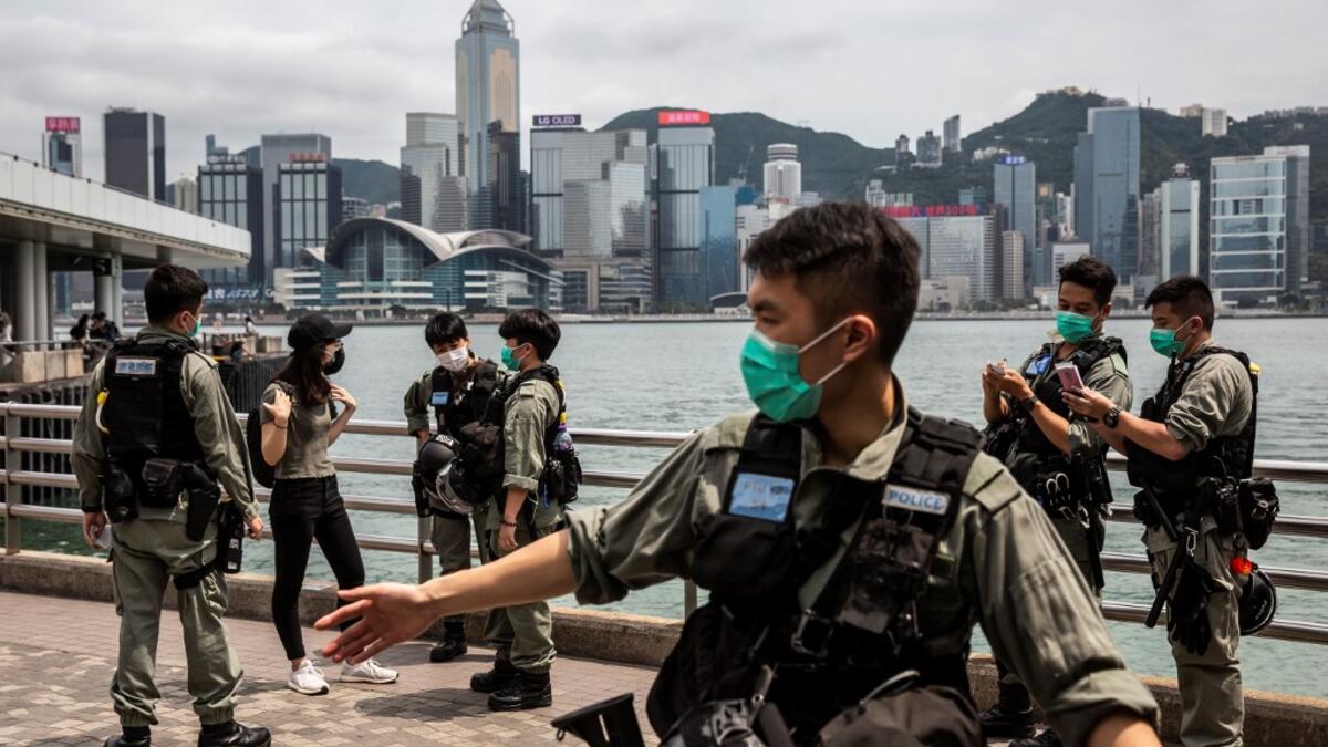 Police officers patrol the Tsim Sha Tsui waterfront where protests by pro-democracy demonstrators calling for the citys independence were scheduled to take place in Hong Kong on May 10, 2020. ISAAC LAWRENCE / AFP