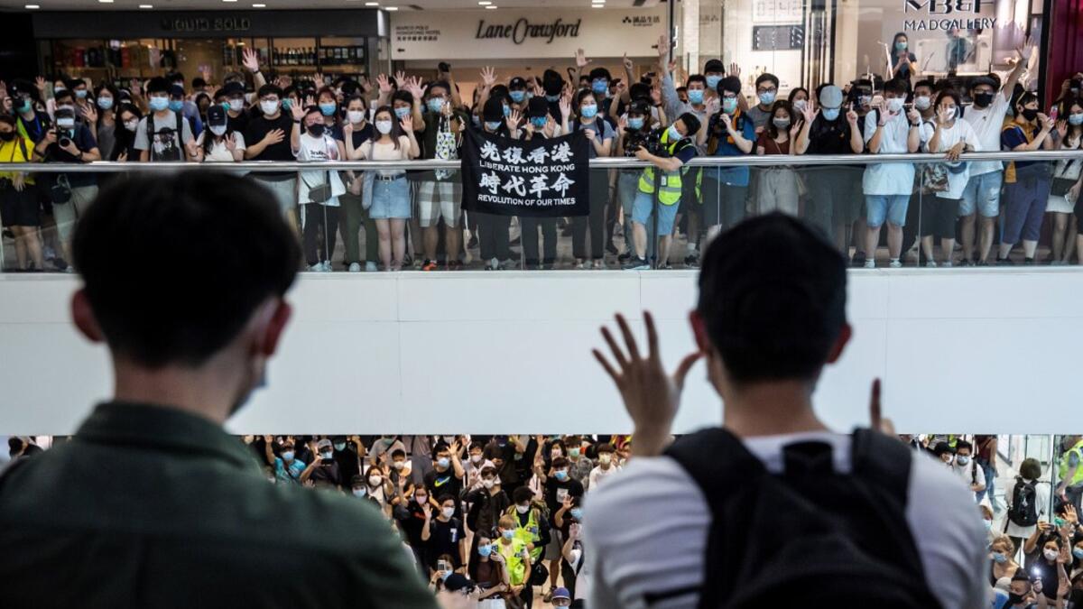 Pro-democracy demonstrators protest calling for the city's independence in Hong Kong on May 10, 2020. ISAAC LAWRENCE / AFP