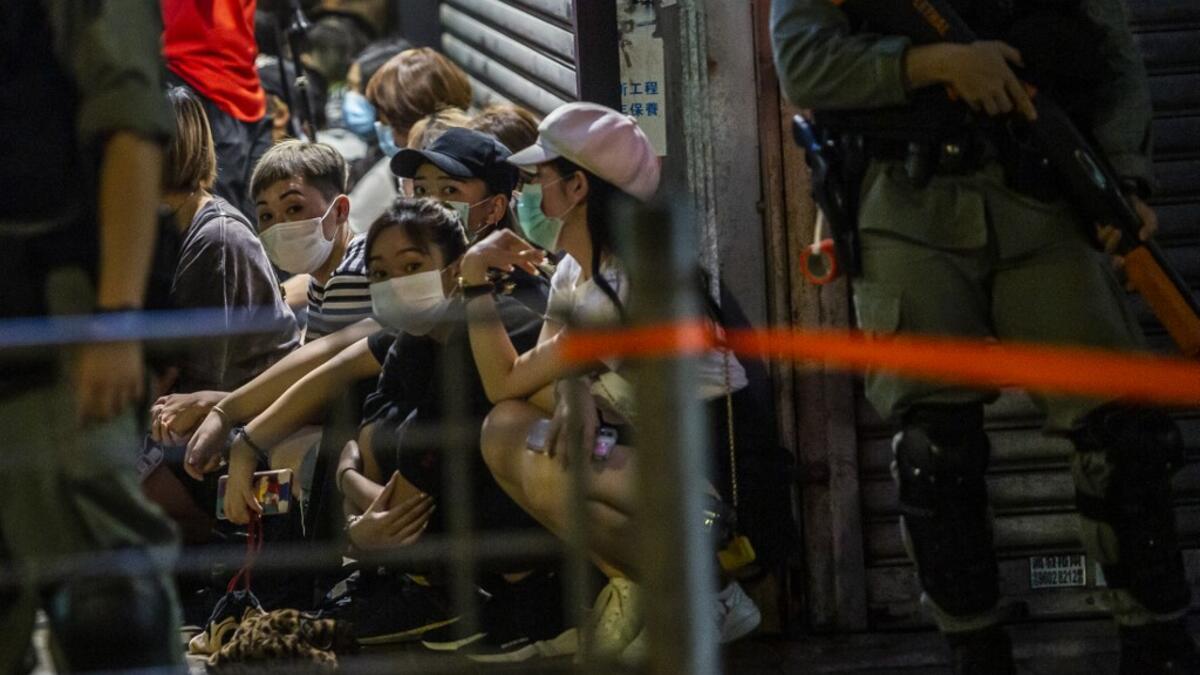 Police detain a group of people during a pro-democracy protest calling for the city's independence in Hong Kong on May 10, 2020. ISAAC LAWRENCE / AFP