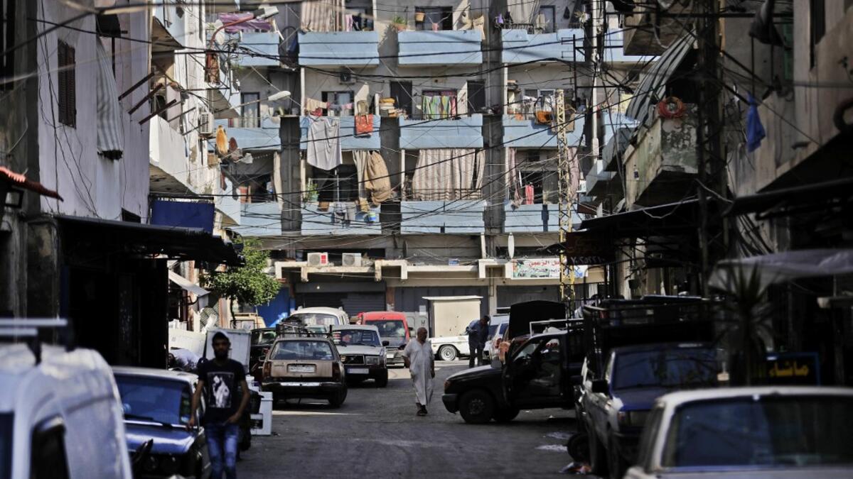 A man browses a phone while sitting in a workshop in the Bab al-Tabbaneh neighbourhood of Lebanon's northern city of Tripoli on June 3, 2020. Thousands of residents of Lebanon's northern Tripoli struggle to put food on the table, as the country's worst economic crisis in decades has picked up in speed in recent weeks, with food prices rising by more than 70 percent since the autumn. Inflation has been a blow in the country where more than 45 percent of the country's population now lives below the poverty li