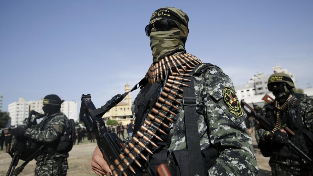 Members of the Palestinian Islamic Jihad group take part in a military parade during a condolence ceremony for the movement's former leader Ramadan Shalah in Gaza city, on June 8, 2020, two days after his death in neighbouring Lebanon. The 62-year-old was buried in Syria on June 7, a day following his death after a long illness. Mohammed ABED / AFP