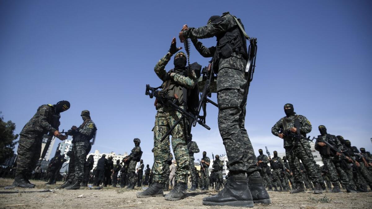 Members of the Palestinian Islamic Jihad group take part in a military parade during a condolence ceremony for the movement's former leader Ramadan Shalah in Gaza city, on June 8, 2020, two days after his death in neighbouring Lebanon. The 62-year-old was buried in Syria on June 7, a day following his death after a long illness. Mohammed ABED / AFP