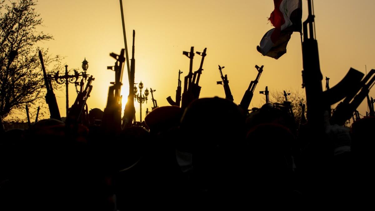 Members of the Hashed al-Shaabi (Popular Mobilisation) paramilitary force take part in a military parade in the southern Iraqi city of Basra on June 14, 2020, marking the sixth anniversary of its founding after Iraq's top Shiite cleric Grand Ayatollah Ali Sistani called to defend the country from the Islamic State group (IS). Hussein FALEH / AFP