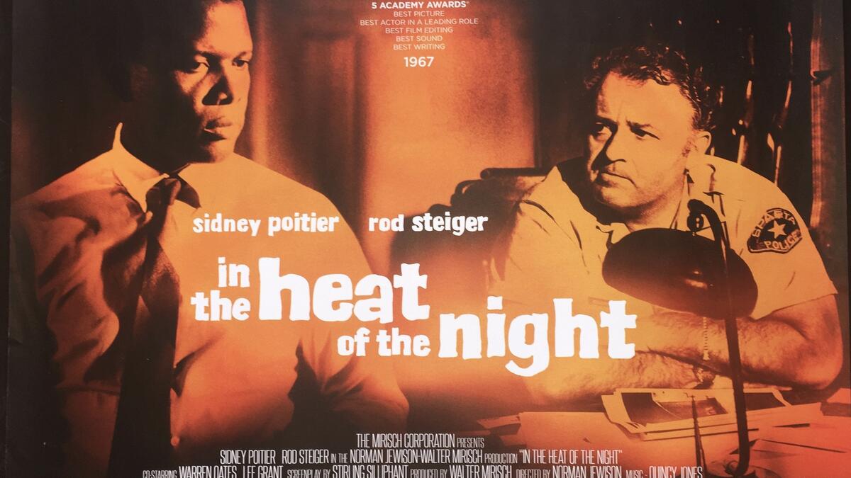 فيلم In the Heat of the Night: يستند على رواية "جون بول" عام 1965 والتي تروي قصة "فيرجيل تيبس"، وهو شرطي أسود من فيلادلفيا يشارك في التحقيق في جريمة قتل في بلدة صغيرة في ميسيسيبي.