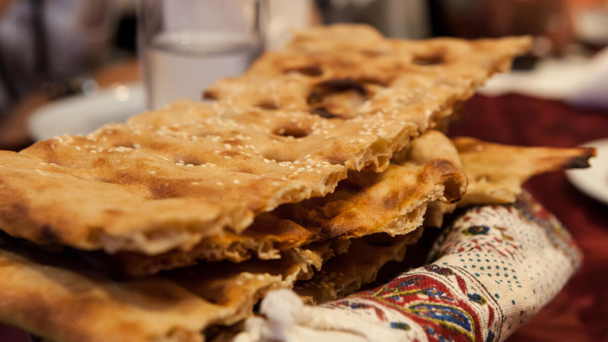 Sangak, a leavened Iranian flatbread. In Persian 'sangak' means little stone, as the bread is baked on small stones in a traditional oven (Shutterstock)