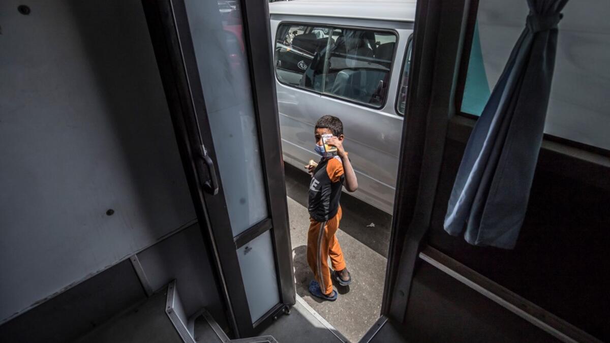 A homeless child leaves one of the mobile units run by the Egyptian authorities and used as part of the "Atfal bala ma'wa" (Children without a home) social program, in the capital Cairo's Abbasia district on June 22, 2020. Khaled DESOUKI / AFP