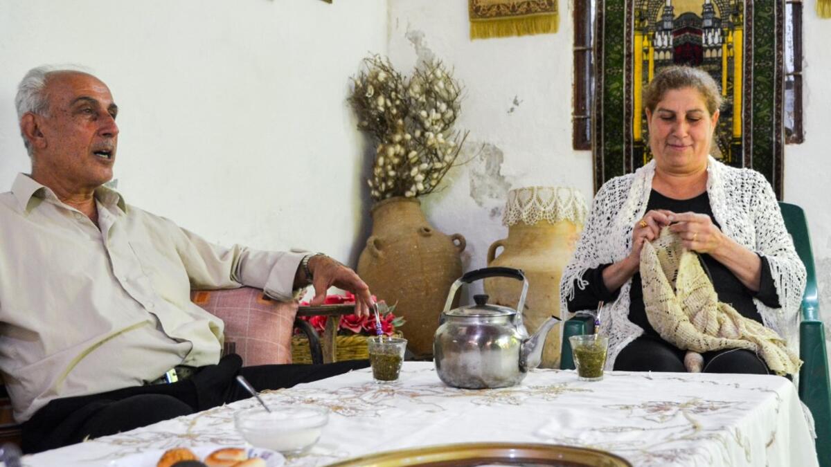 After Syria's war whisked away the silkworms from his mulberry trees, 65-year-old Mohammed Saud instead turned his idle home workshop into a silk museum to celebrate the ancient craft. MAHER AL MOUNES / AFP